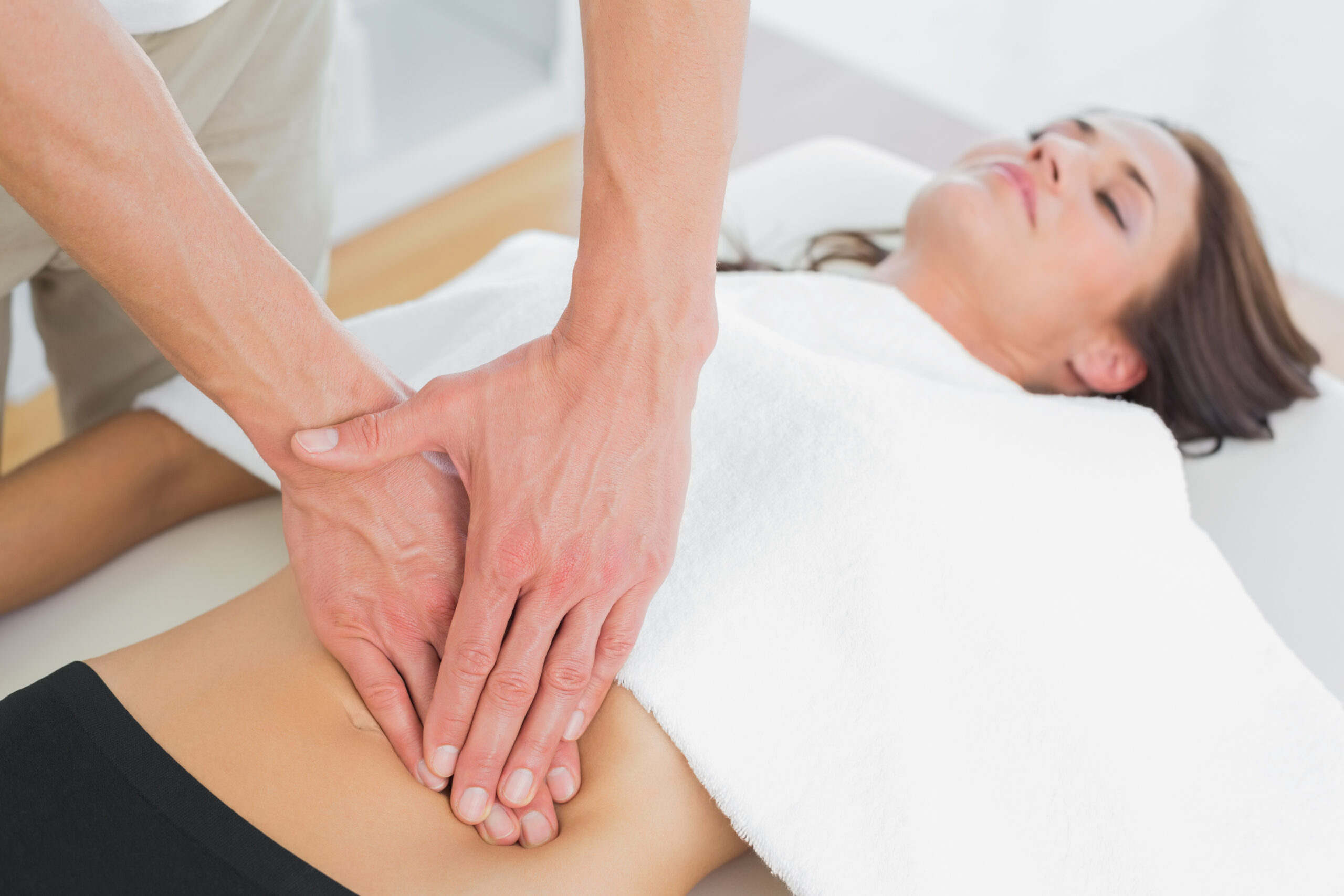 closeup-physiotherapist-massaging-womans-body